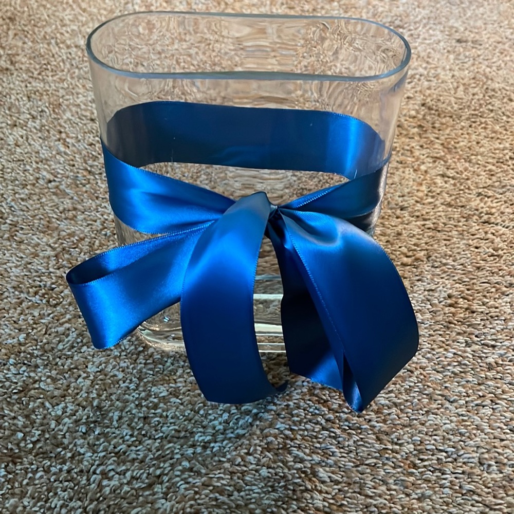 Clear glass, oval, flower, vase with blue ribbon